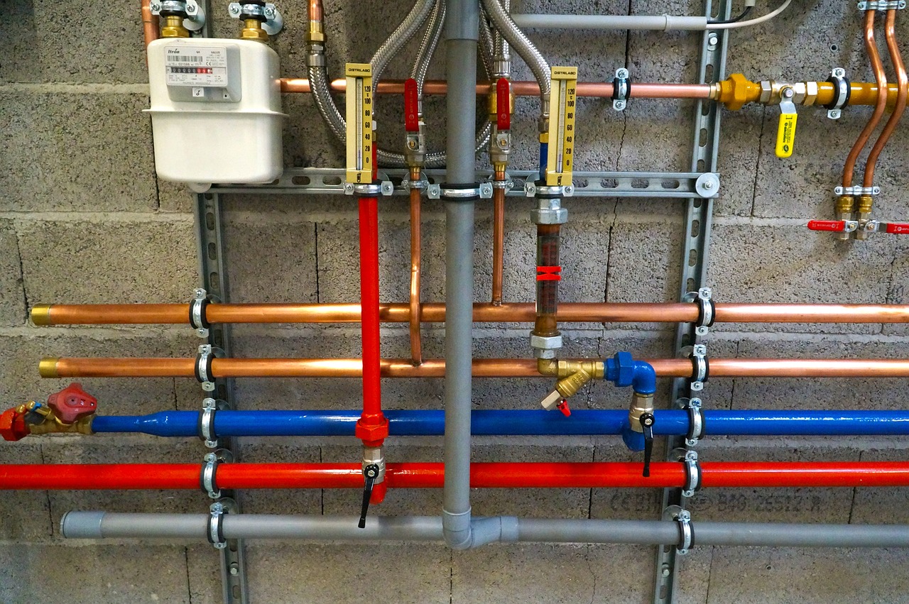 Plumbing system installation in Chicago with color-coded pipes